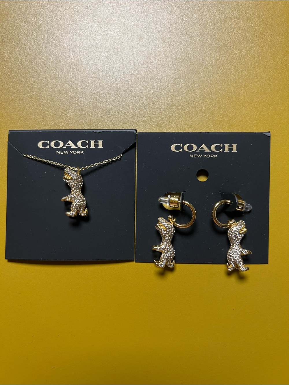 Coach Gold-Tone Pave Crystal T-Rex Necklace & Hoop Earrings Set